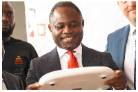 Kwabena Mintah Akandoh inspects donated medical equipment