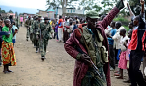 A Congolese army soldier responds to cheers from civilians as the army enters the town of Bunagana A Congolese army soldier responds to cheers from civilians as the army enters the town of Bunagana