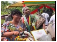 Snippet of the farmer and wife on his prize tricycle.