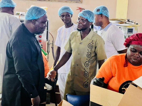 William Adzowu (L) visited several businesses in the Obuasi municipality