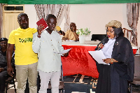 The re-elected Ellembelle Presiding Member taking his oath of office