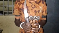 Hand of suspect holding the knife e allegedly use take stab im mama