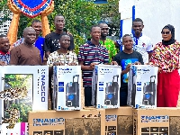 Electroland Ghana Limited officials with winners during the presentation