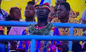 A dejected Hearts of Oak supporter