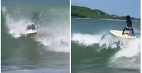 A Ghanaian man showcasing his impressive surfing skills