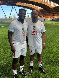 Asamoah Gyan (left) and CAF President Patrice Motspe