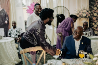 Ghanaian Highlife musician Bisa Kdei  shaking hands with former President Akufo-Addo