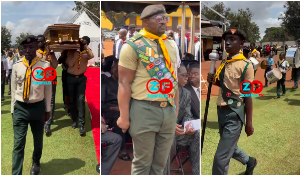 Pall bearers lifting the casket at the burial ceremony
