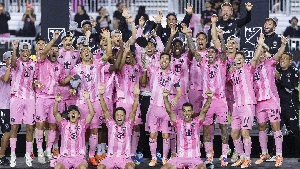 Players of Inter Miami celebrating with the trophy