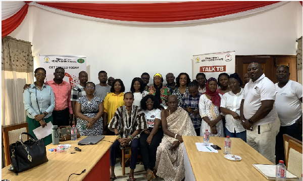 Attendees of TB/HIV review meeting pose for a photo during the meeting