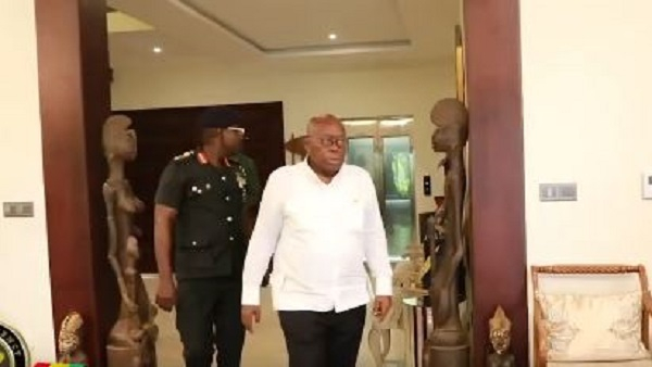 Akufo-Addo is seen here with his ADC behind him