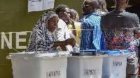 A voter casts her ballot at Wazo Hill polling station