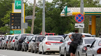 Cars queue at a petrol station on the peninsula in early June amid already restricted fuel sales
