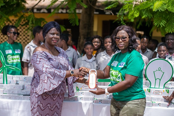 Shirley Tony Kum presenting the solar lamps to Habibah Kotomah