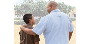 A father is seen with his son