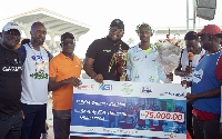 Kwabena Boateng (3rd from the left), joins other dignitaries to present a dummy cheque and trophy