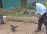 The pastor is seen chasing a black crow, which he claimed interrupted his preaching