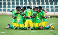 Aduana Stars players pray before a game