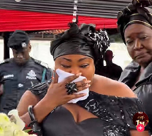 Mamaga was full of tears as she filed past her sister's remains
