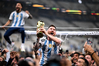 Messi with the World Cup trophy