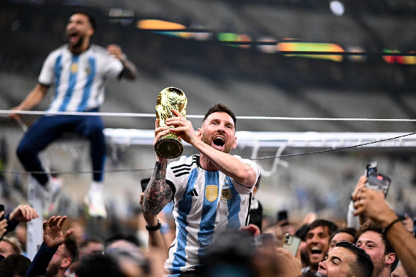 Messi with the World Cup trophy