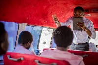 A preacher man sharing the word of God in a trotro (Kuulpeeps photo)