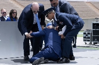Biden being helped up after falling