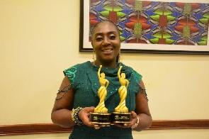 Georgina Asare Fiagbenu showcasing her awards