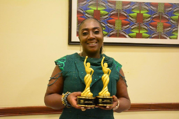 Georgina Asare Fiagbenu showcasing her awards