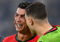 Cristiano Ronaldo being consoled by Diogo Dalot