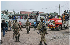 M23 rebels escort government soldiers and police who surrendered to an undisclosed location in Goma