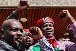 Nicholas Oyoo (L) and Bob Njagi (R) were greeted by supporters when they arrived back in Kenya'