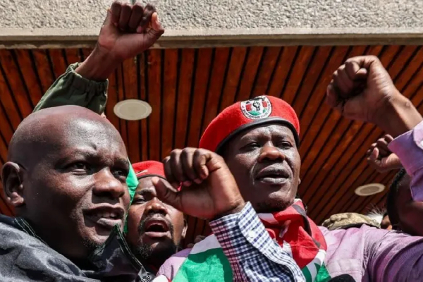 Nicholas Oyoo (L) and Bob Njagi (R) were greeted by supporters when they arrived back in Kenya'