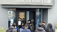 Pipo dey stand in front of Silicon Valley Bank