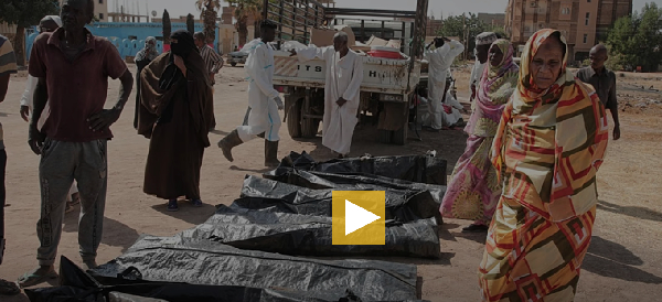 Relatives check the body bags of victims of Sudan’s two-year conflict