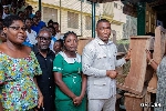 MP for Tarkwa-Nsuaem Constituency and others presenting furniture to a school