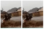 Watch the moment a motorbike rider and passenger are swept away by floodwaters
