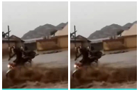 The two pictured on the motorbike moments before they were swept away by floodwaters