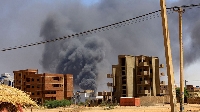 Smoke rises above buildings after an aerial bombardment during clashes