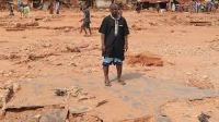 Adamu Yusuf lost his wife and newborn baby in the floods which swept through his town