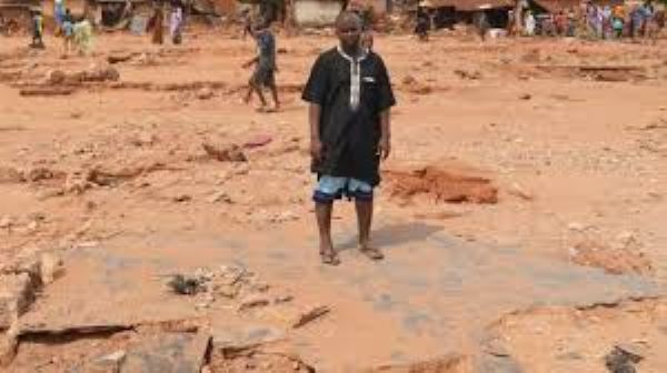 Adamu Yusuf lost his wife and newborn baby in the floods which swept through his town