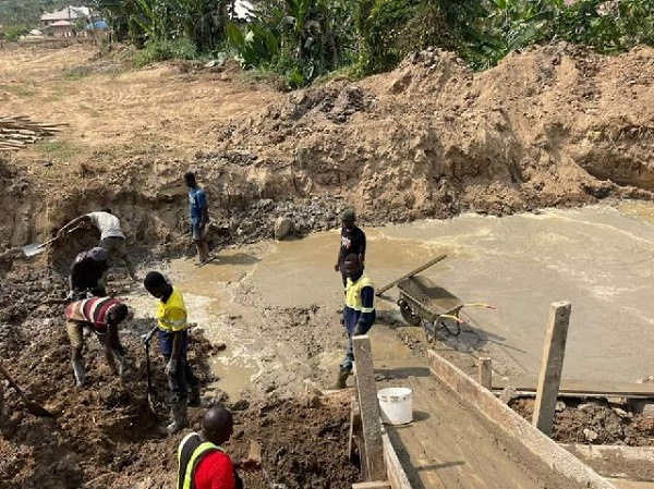 Men at work on the Atobrakrom-Chapel Square box bridge at Bogoso