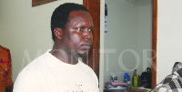 Rev Fr Dominic Alinga being led to Entebbe Chief Magistrates' Court by prison warders on Friday.