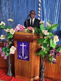 Pastor Simon Goka speaking at the event