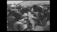 Trader and buyers engaging in trade during the 1966 Christmas season in Accra