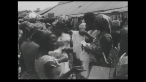 Trader and buyers engaging in trade during the 1966 Christmas season in Accra