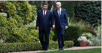 US President Joe Biden and Chinese President Xi Jinping walk together after a meeting