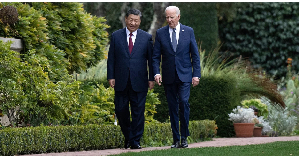 US President Joe Biden and Chinese President Xi Jinping walk together after a meeting