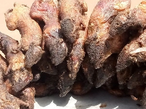 A photo of some grilled bush meat