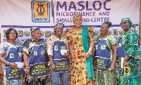 CEO of MASLOC, Hajia Abibata Shanni Mahama Zakariah with some of the beneficiaries